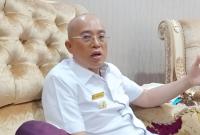 Bupati Gusnan Mulyadi.