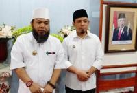 Helmi Hasan dan Dedy Wahyudi 